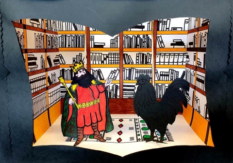 Zdjęcie przedstawia scenografię do przedstawienie teatrzyku kukiełkowego pt. „Bohaterowie kazimierskich legend nocą w bibliotece”.